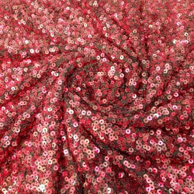 Paillettes con base tulle con riflessi fucsia e rosso Alt.145 cm