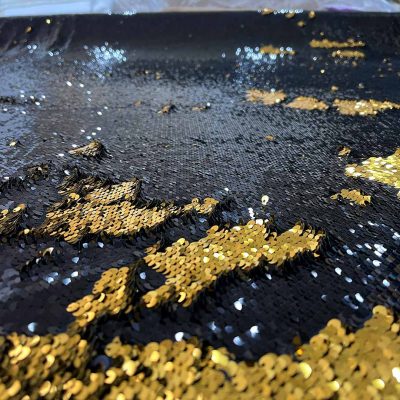 Tessuto con paillettes doppio colore oro nero 4