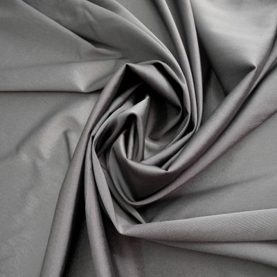 Tessuto per abbigliamento semilucido in cotone elasticizzato - grigio