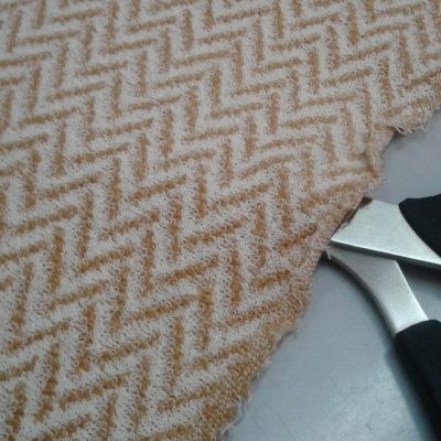 Misto lana motivo geometrico - arancione e panna Alt.170cm