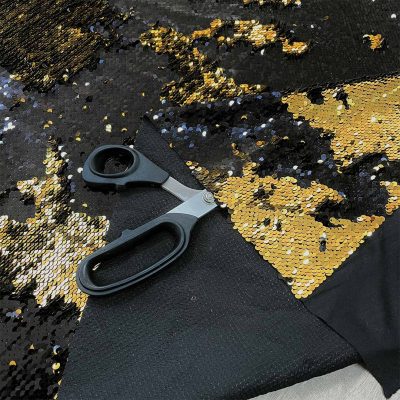 Tessuto con paillettes doppio colore oro nero 1