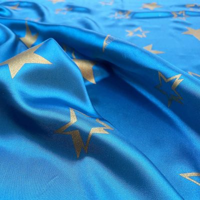 Raso con stelle dorate su sfondo turchese 1