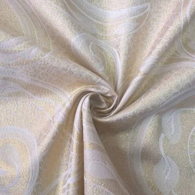 Tessuto arredo double face con motivi oro - panna
