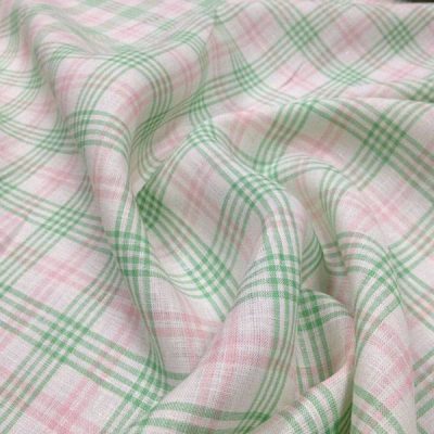 Tessuto in lino a righe e quadri verde e rosa - sfondo bianco