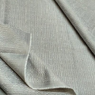Tessuto arredo misto cotone elegante con trama luminosa in rilievo al metro argento piegato
