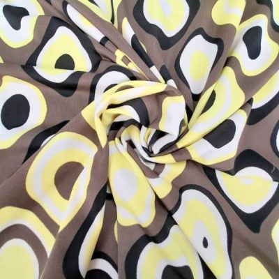 Tessuto bielastico con stampa all over optical Alt.135 cm