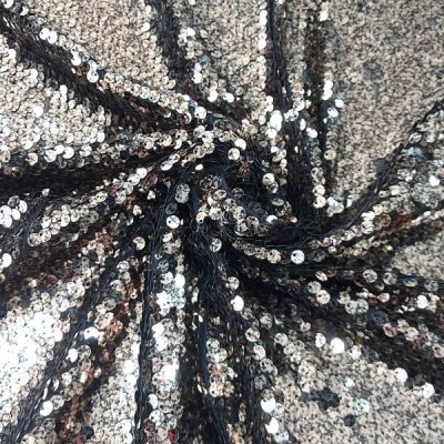 Tessuto con paillettes color nero Alt.140 cm