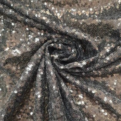 Tessuto con paillettes nero Alt.150 cm