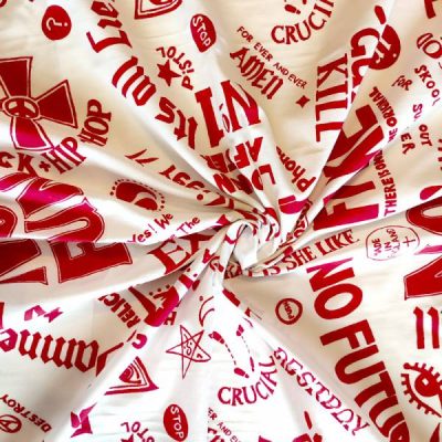 Cotone con fantasie in rosso su base bianca Alt.140cm