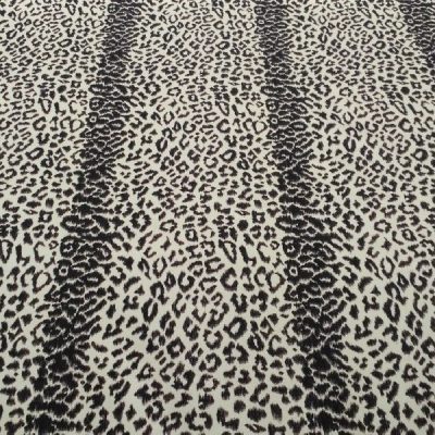 Cotone elasticizzato a fantasia animalier - nero e giallo Alt.160cm