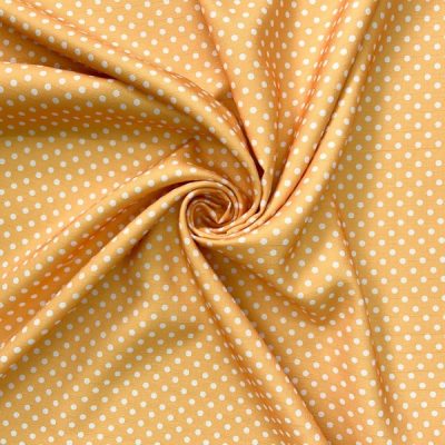 Tessuto multiuso con pois bianchi su giallo ambra 3