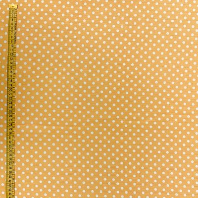 Tessuto multiuso con pois bianchi su giallo ambra 5