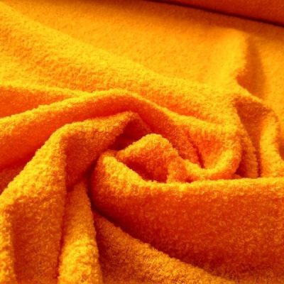 Tessuto per abbigliamento effetto boucl&egrave; arancione 2