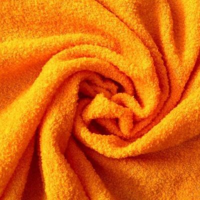 Tessuto per abbigliamento effetto boucl&egrave; arancione 1