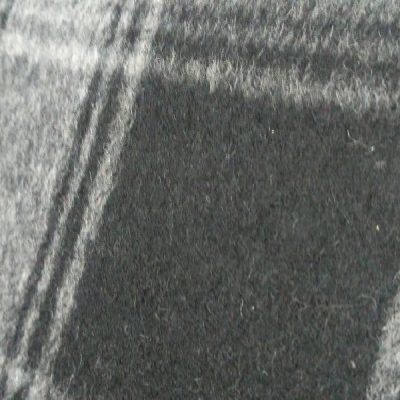 Tessuto per abiti e cappotti a pannetto con motivo a quadri nero bianco dettaglio