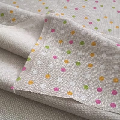 Tessuto per arredamento in misto cotone a piccoli pois multicolore su sfondo tortora 3 piegato