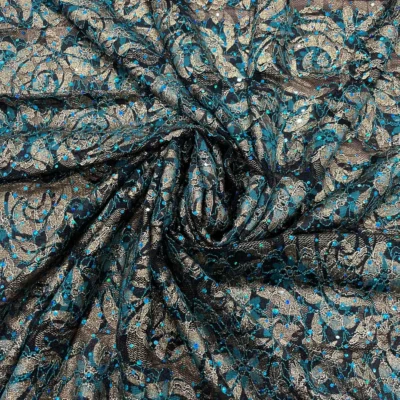 Pizzo elasticizzato dorato e ottanio con punti luce 2