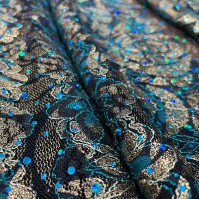 Pizzo elasticizzato dorato e ottanio con punti luce 1