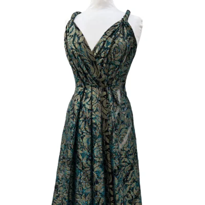 Pizzo elasticizzato dorato e ottanio con punti luce