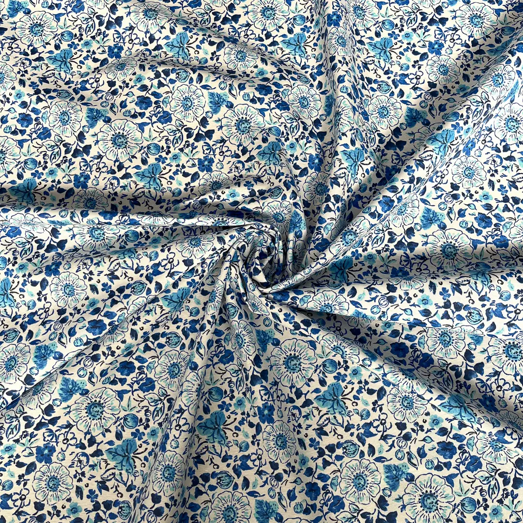 Tessuto tovagliato resinato misto cotone – Fiori blu su fondo écru - immagine 2